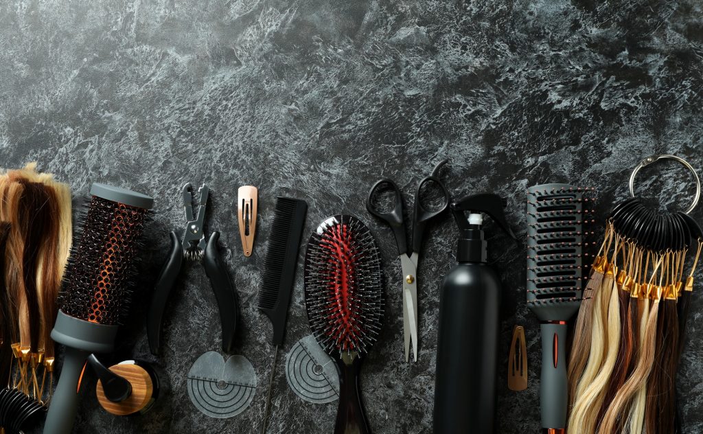 Composition with hair extension accessories on dark background